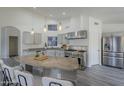 Modern kitchen featuring granite countertops and stainless steel appliances at 2930 N 154Th Dr, Goodyear, AZ 85395