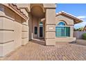 Inviting entryway with brick pavers, arched entrance and modern architecture at 3106 E Hiddenview Dr, Phoenix, AZ 85048