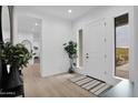 Bright and airy entryway with wood floors at 3588 W New Life Ln, Queen Creek, AZ 85144