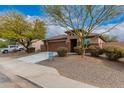 Charming one-story home with a two-car garage and neat landscaping at 3663 S Hassett --, Mesa, AZ 85212