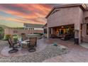 Extended backyard patio with seating area and hot tub at 4202 S Cordia Ct, Gold Canyon, AZ 85118