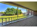 Spacious back porch with a view of the lush backyard and well maintained lawn at 424 E Lehi Rd, Mesa, AZ 85203