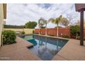 Inviting swimming pool with surrounding patio at 4362 E Clifton Ave, Gilbert, AZ 85295