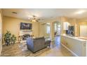 Living room features a fireplace and a comfortable seating area at 4711 E Silverwood Dr, Phoenix, AZ 85048