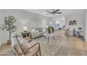 Bright living room with light beige sofas and chairs at 4901 E Sheridan St, Phoenix, AZ 85008