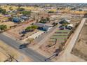 Aerial view of a property with barn, arena, and RV sites at 52615 W Esch Trl, Maricopa, AZ 85139