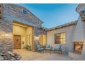 Charming courtyard with fireplace and seating area, perfect for relaxing at 9825 E Sharon Dr, Scottsdale, AZ 85260