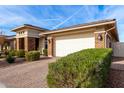 Brick house with 2 car garage and neatly landscaped yard at 10614 E Twister Ave, Mesa, AZ 85212