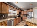 Charming kitchen features stainless appliances, granite counters, and lots of cabinet space at 11346 E Renata Ave, Mesa, AZ 85212