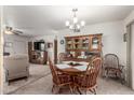 Cozy dining area adjacent to kitchen with access to backyard at 1417 S Grand Dr, Apache Junction, AZ 85120