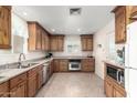 Spacious kitchen with granite countertops and wood cabinets at 1417 S Grand Dr, Apache Junction, AZ 85120