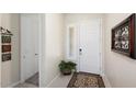 Bright and airy entryway with tile flooring and decorative wall art at 24211 N 168Th Ln, Surprise, AZ 85387