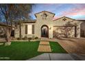 Beautiful stucco home with a welcoming front porch and landscaped yard at 25891 N 104Th Dr, Peoria, AZ 85383