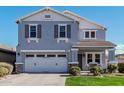 Two-story house with gray exterior, two-car garage, and landscaped front yard at 2865 S Vegas --, Mesa, AZ 85212