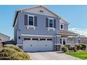 Two-story house with gray exterior, two-car garage, and landscaped front yard at 2865 S Vegas --, Mesa, AZ 85212