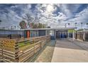 Mid-century home with gray exterior and orange door at 2937 E Osborn Rd, Phoenix, AZ 85016