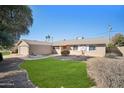 Single-story house with a well-maintained lawn and walkway at 4016 W Myrtle Ave, Phoenix, AZ 85051