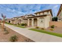 Row of two-story homes with similar design and landscaping at 4159 E Pony Ln, Gilbert, AZ 85295