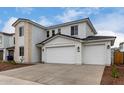 Beautiful two-story home featuring a three car garage and stone accents with lush landscaping at 5025 W Beryl Ave, Glendale, AZ 85302