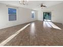 Spacious living room with tile floors and plenty of natural light at 6038 S Connie Ln, Gilbert, AZ 85298