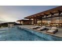 Luxury resort-style pool with patio and lounge chairs at 7436 E Continental Mountain Dr, Cave Creek, AZ 85331
