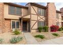 Brick townhouse exterior with landscaping and walkway at 7905 W Thunderbird Rd # 309, Peoria, AZ 85381
