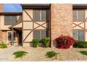 Brick townhouse exterior with landscaping and walkway at 7905 W Thunderbird Rd # 309, Peoria, AZ 85381