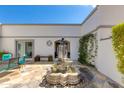 Private courtyard with fountain and seating area at 8219 N 3Rd Ave, Phoenix, AZ 85021