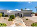 Front entrance with walkway, fountain and gated entry to home at 8219 N 3Rd Ave, Phoenix, AZ 85021