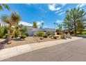 Landscaped front yard with desert plants and walkway to entrance of home at 8219 N 3Rd Ave, Phoenix, AZ 85021