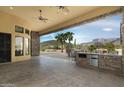 Extended covered patio with mountain views at 10630 E Cactus View Cir, Gold Canyon, AZ 85118