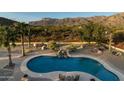 Relaxing pool and spa with mountain backdrop at 10630 E Cactus View Cir, Gold Canyon, AZ 85118