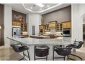 Gourmet kitchen featuring granite island, stainless steel appliances, and custom cabinetry at 12067 N 135Th Way, Scottsdale, AZ 85259