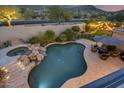 Inviting pool and spa surrounded by a beautifully landscaped backyard at 12067 N 135Th Way, Scottsdale, AZ 85259