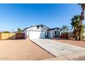 New construction home with a two-car garage and fenced backyard at 1217 S Desert View Pl, Apache Junction, AZ 85120