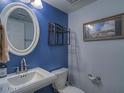 Small bathroom with white sink and blue walls at 1231 E Helena Dr, Phoenix, AZ 85022