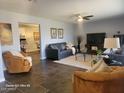 Spacious living room with tile floors, comfortable seating, and a view of the office at 1707 E Mclellan Blvd, Phoenix, AZ 85016