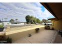 Covered patio with views of the neighborhood and street at 1707 E Mclellan Blvd, Phoenix, AZ 85016