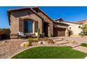 Landscaped front yard with attractive curb appeal and a two-car garage at 1820 N Bernard --, Mesa, AZ 85207