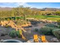 Spacious backyard with mountain views, pool, and lounge chairs at 19115 E Tonto Verde Dr, Rio Verde, AZ 85263