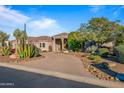 One-story home exterior with desert landscaping at 19115 E Tonto Verde Dr, Rio Verde, AZ 85263