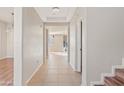 Bright hallway with tile floors leading to the living areas at 19359 E Canary Way, Queen Creek, AZ 85142