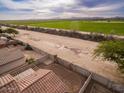 Aerial view showing a house with a backyard and surrounding farmlands at 19422 N Smith Dr, Maricopa, AZ 85139