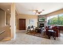 Spacious living room with fireplace and stone accent wall at 19475 N Grayhawk Dr # 2169, Scottsdale, AZ 85255