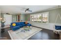 Bright living room with hardwood floors and comfortable seating at 2011 E La Jolla Dr, Tempe, AZ 85282