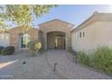 Front entrance with stonework and a paved walkway at 24435 S 195Th St, Queen Creek, AZ 85142