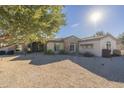 House exterior showcasing stone accents and landscaping at 24435 S 195Th St, Queen Creek, AZ 85142