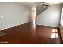 Living room with hardwood floors and neutral walls at 25527 W Burgess Ln, Buckeye, AZ 85326