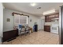 View of kitchen area with white appliances and tile flooring at 2738 N 40Th Dr, Phoenix, AZ 85009