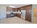 Modern kitchen with stainless steel appliances and dark wood cabinets at 2738 N 40Th Dr, Phoenix, AZ 85009